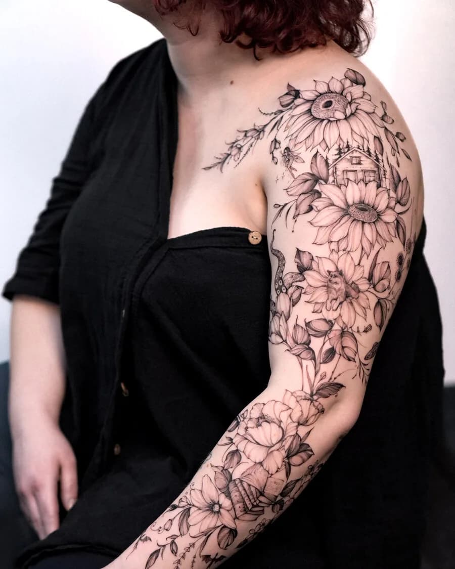 Feines florales Linien-Tattoo am Arm.
